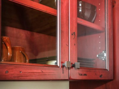 Material: Distressed Knotty Alder with Red Stain & Black Glaze / Cabinet Style: Overlay